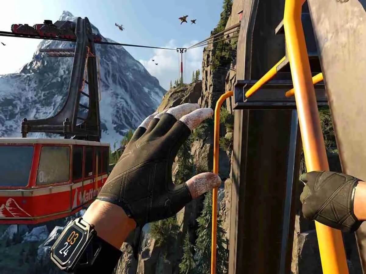 High-altitude action gripping a cable car on a snowy mountain.