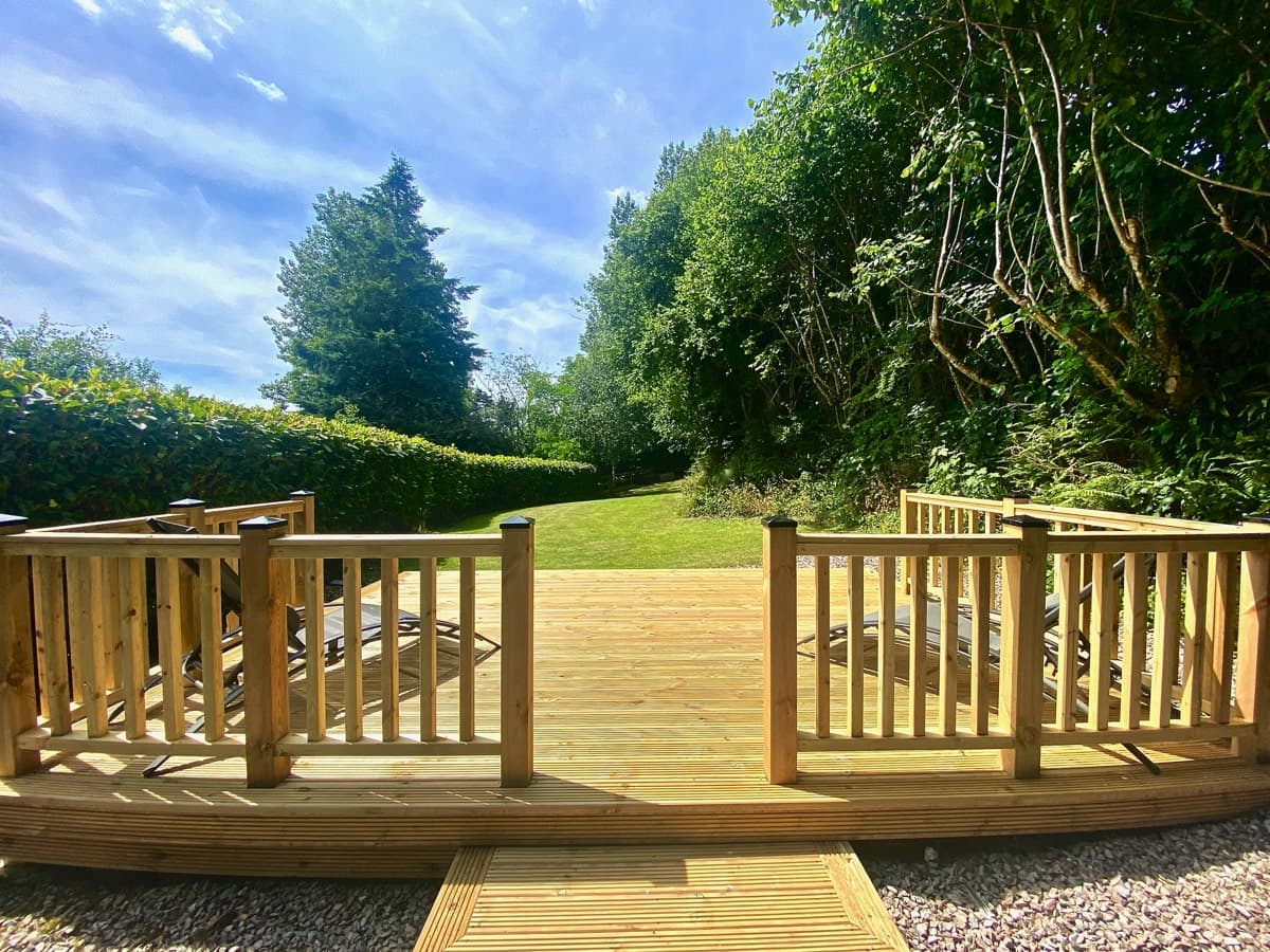 Tranquil and secluded garden space with deck at the Sunridge Cubes - Sunridge Retreats