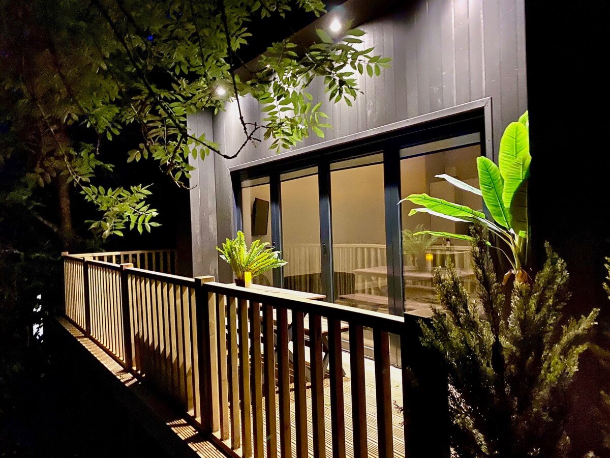 Sunridge cubes balcony lit up at night.