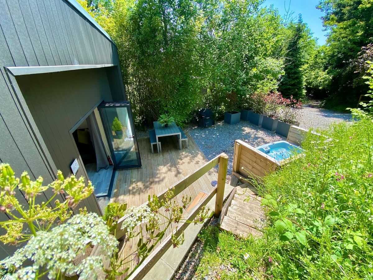Sunridge cubes surrounding area in sunshine, complete with hot tub.