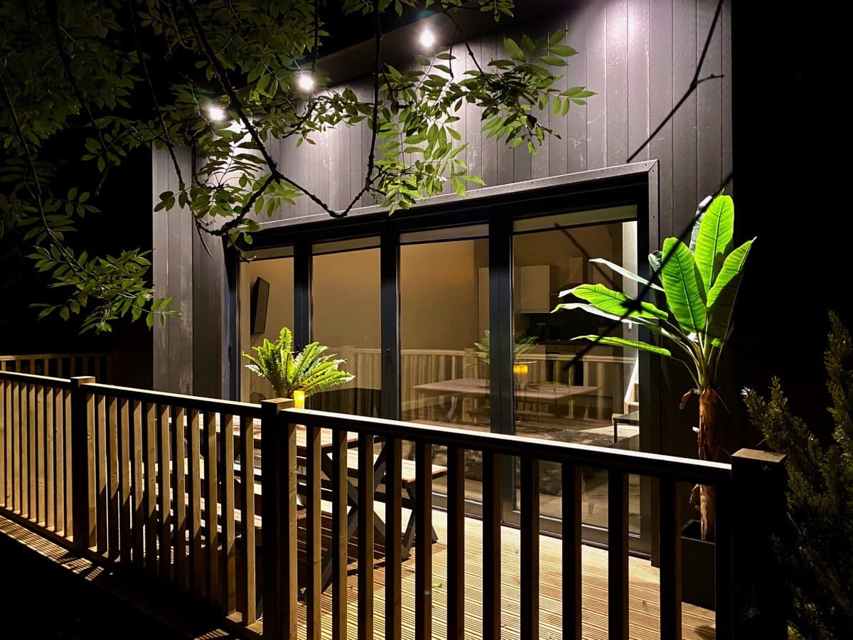 balcony at night with seating at sunridge cubes