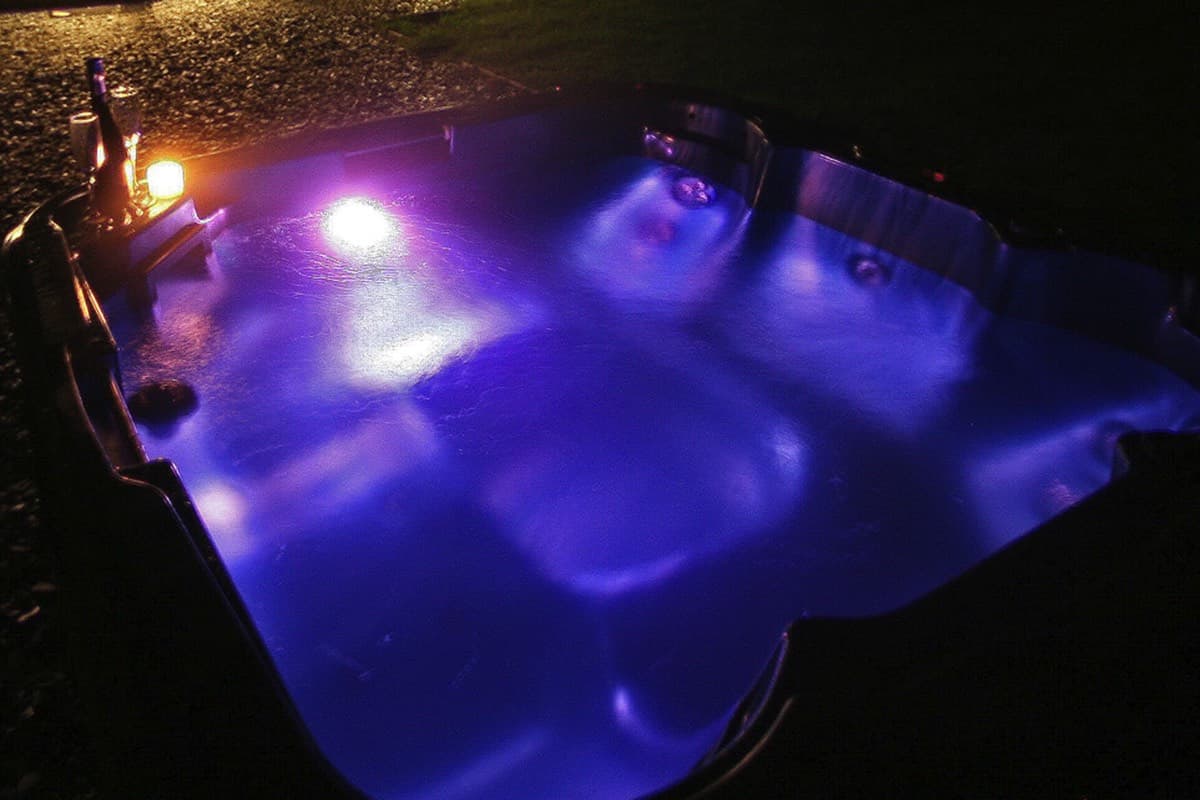 Creating a romantic atmosphere with a nighttime dip in the eco-friendly hot tub at the Ecopod