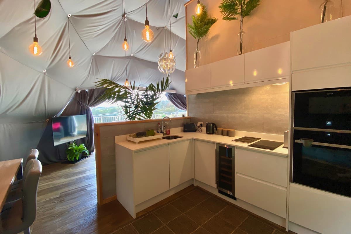 Bright and airy kitchen with natural light in the Sunridge Geodome - Sunridge Retreats