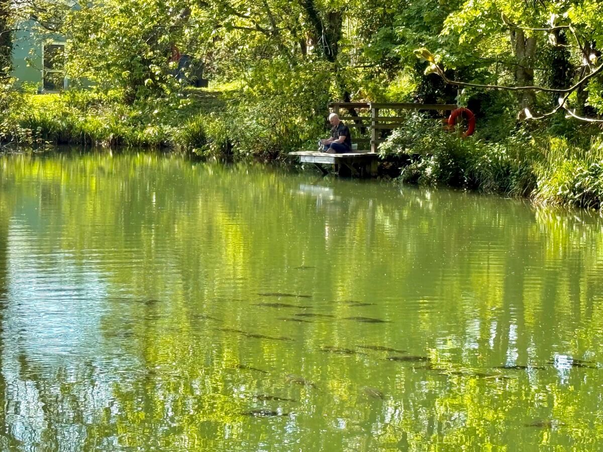 Tranquil lakeside fishing spot near the dome