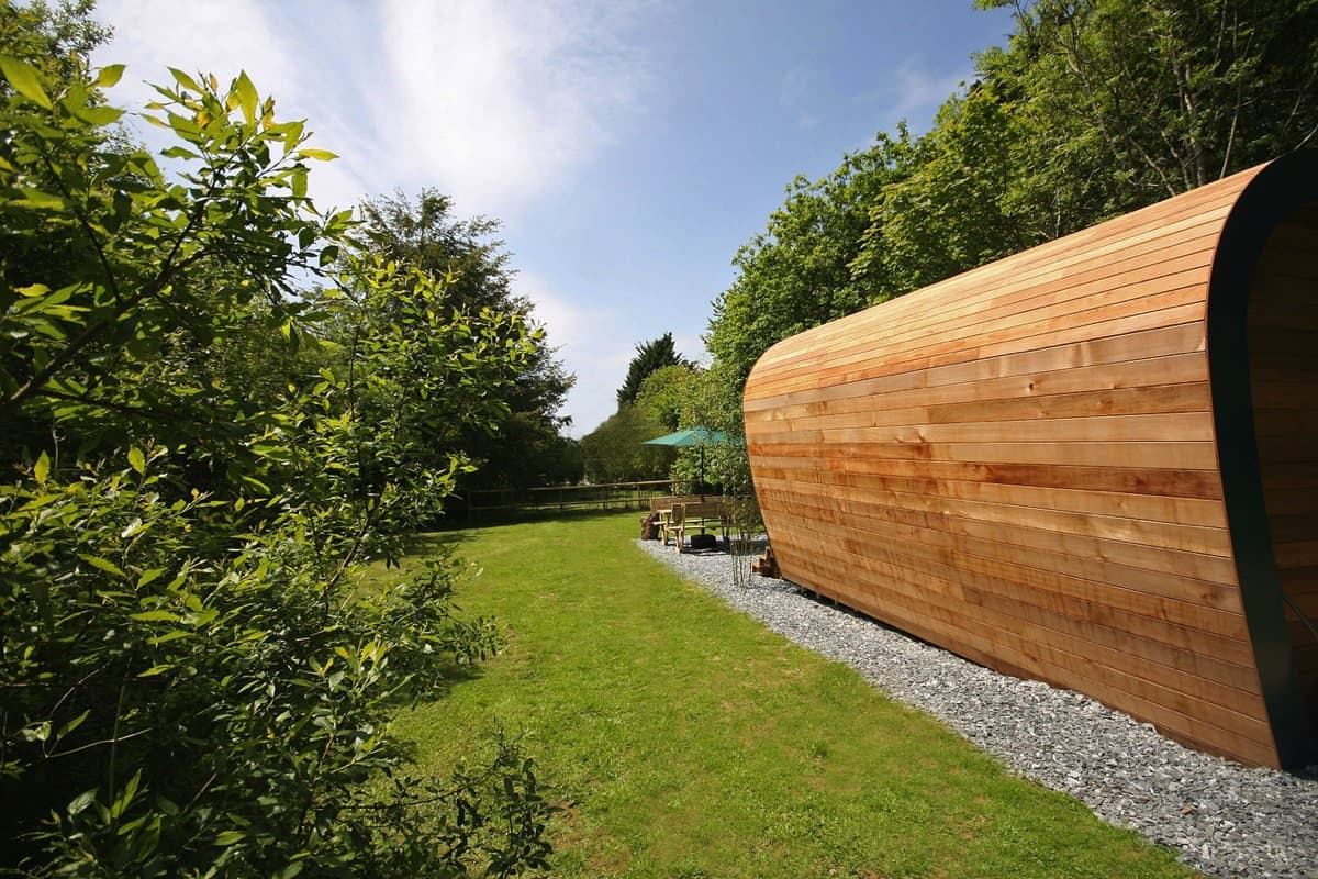 A sustainable ecopod accommodation, overlooking a lush garden