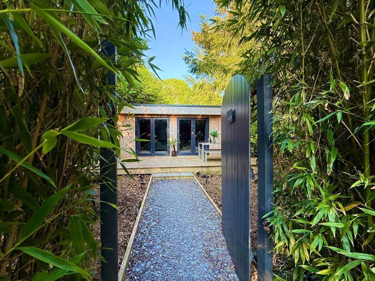 Bamboo garden entrance leading to The Hub cinema room.
